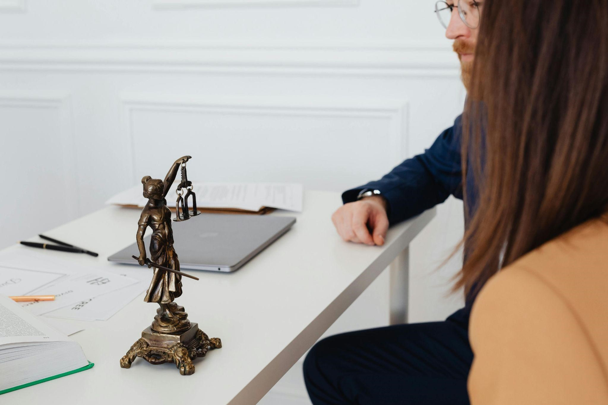 An injured worker discussing legal rights with a California workers' compensation attorney.